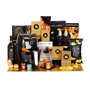 Een paars kerstpakket is gevuld met paarse artikelen, zowel food als non-food.